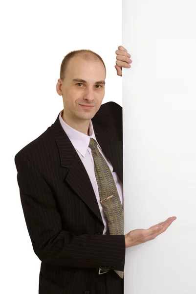 Ευτυχής αρσενικά μόνιμη από λευκό κενό κάρτα — Φωτογραφία Αρχείου