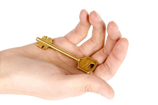 Golden key in the hand — Stock Photo, Image