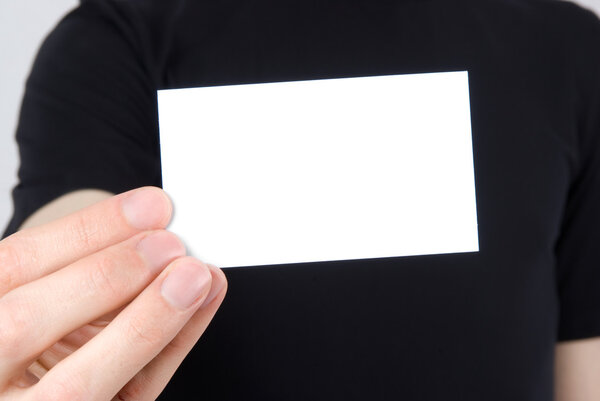 Hand holding an empty business card