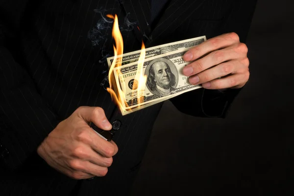 Flaming money in a hand — Stock Photo, Image