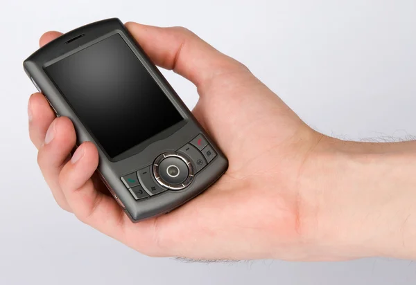 Teléfono móvil en mano de hombre — Foto de Stock