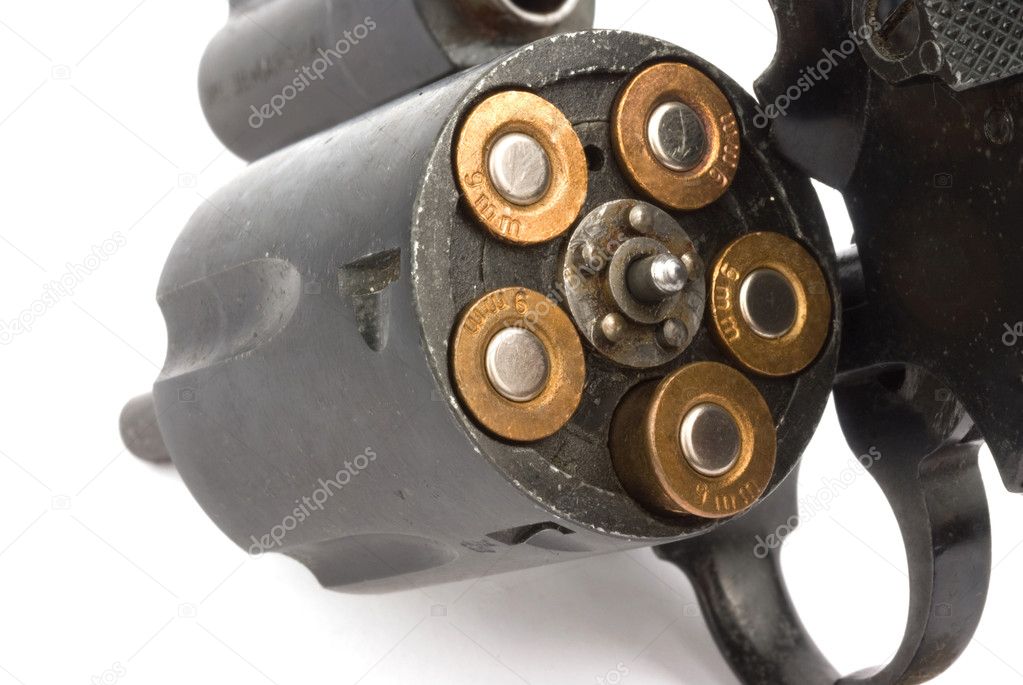 Closeup old revolver with bullets