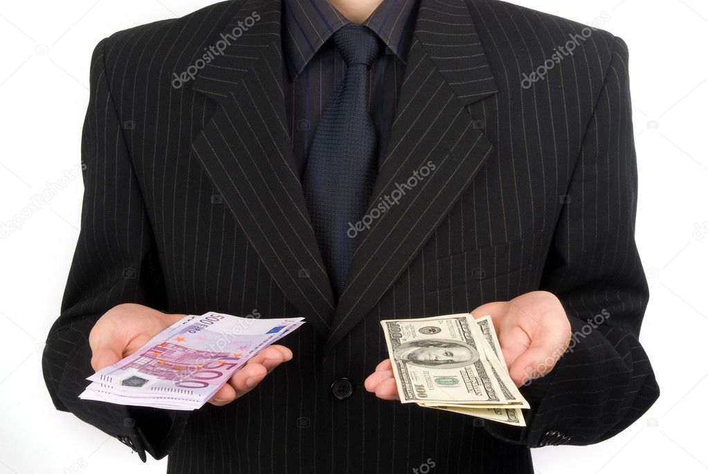 Man in suit holding money