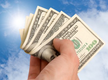 American dollars in a hand clipart