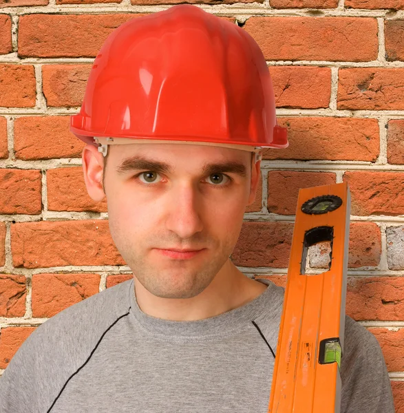 Handyman com chapéu vermelho — Fotografia de Stock