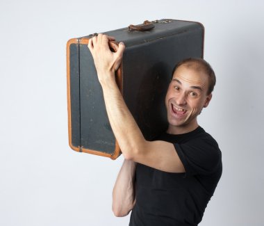 Man holding an old suitcase clipart