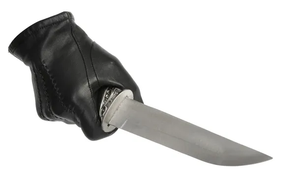 Black leather glove with dagger — Stock Photo, Image
