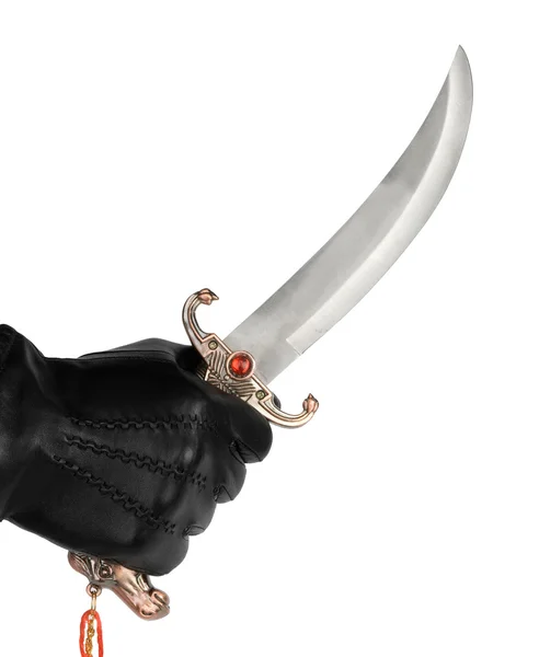 Hand in glove with dagger — Stock Photo, Image
