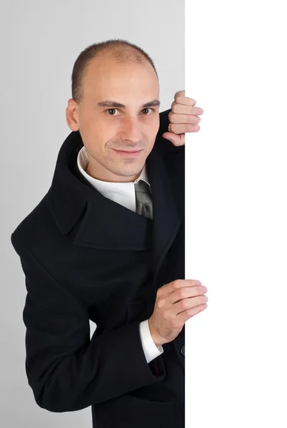 Businessman holding a white board — Stock Photo, Image