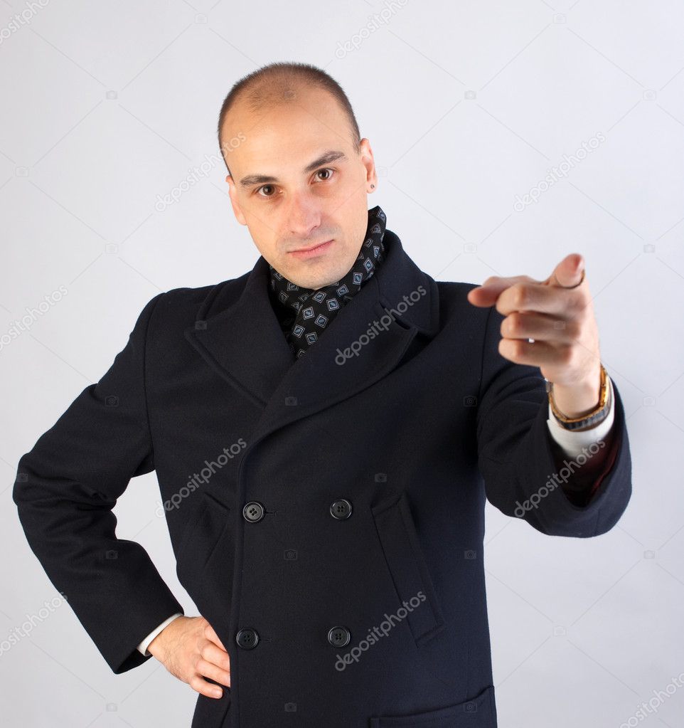 Businessman pointing at viewer