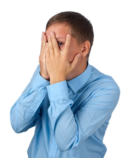 Young man covering his face Stock Photo