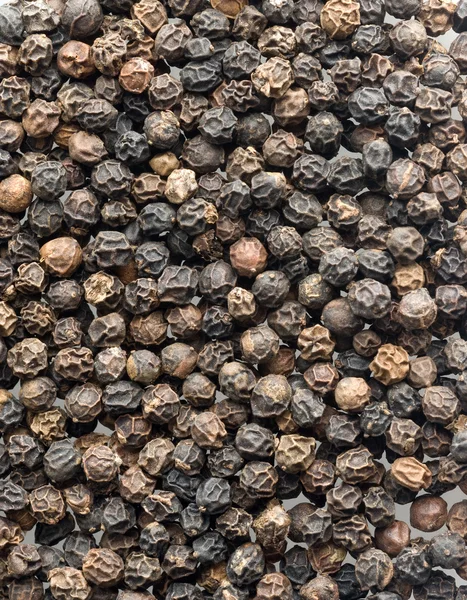 Крупный план черных перцев — стоковое фото