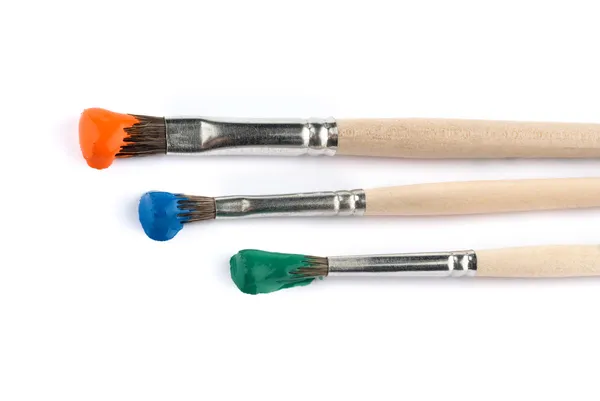 Brushes with paint on them — Stock Photo, Image