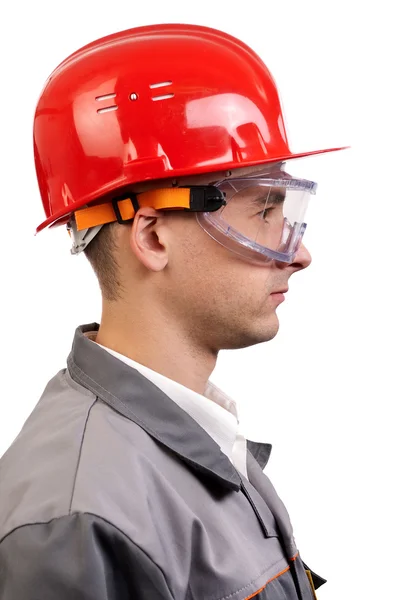 Serious architect in a red hardhat — Stock Photo, Image