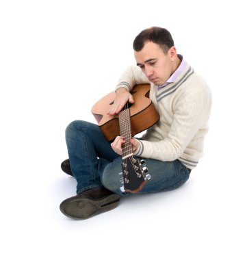 Man playing his acoustic guitar clipart