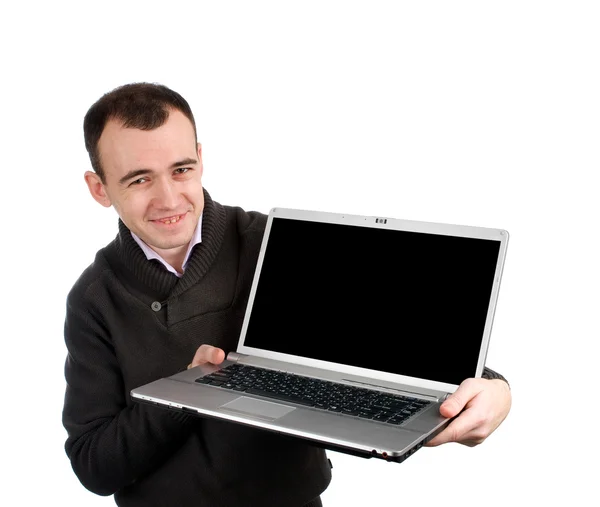 Νέος άνθρωπος που κρατά ένα φορητό υπολογιστή — Φωτογραφία Αρχείου
