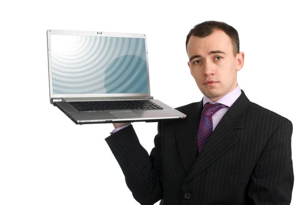 Homem de negócios segurando um computador portátil — Fotografia de Stock