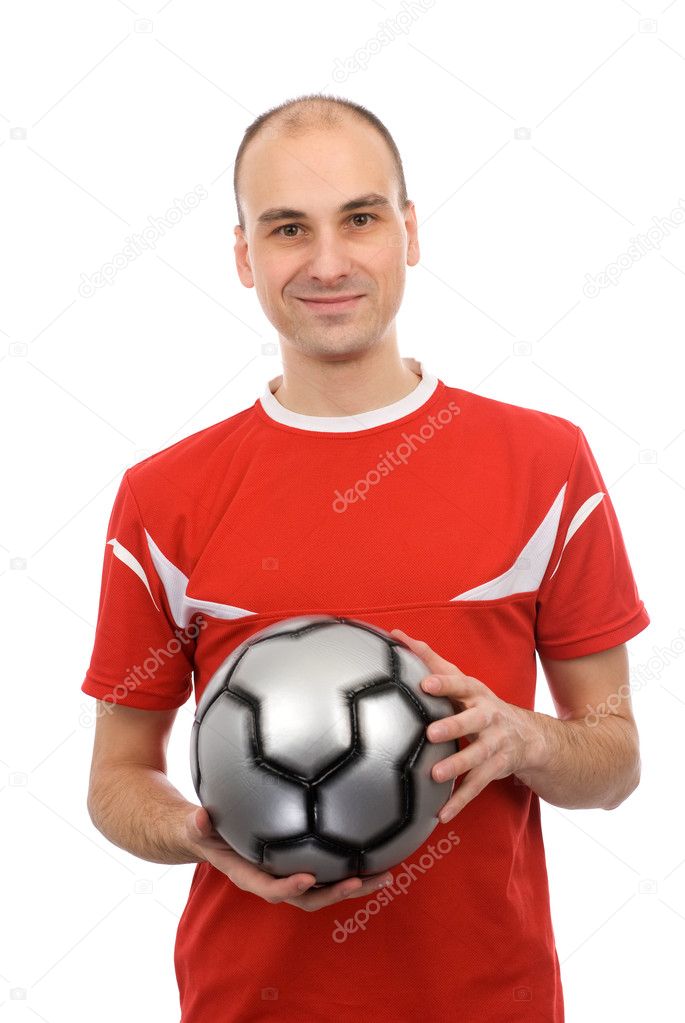 Young man holding a soccer ball