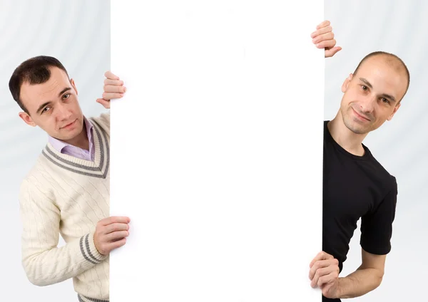 Due uomini con un segno bianco — Foto Stock