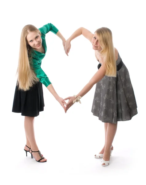 Twee jonge meisjes geïsoleerd op wit — Stockfoto