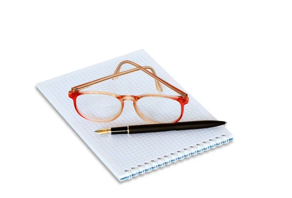 螺旋笔记本上的眼镜 — 图库照片