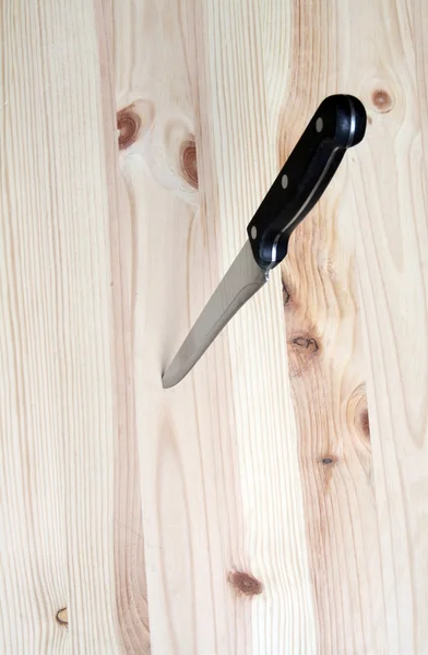 Knife In Wooden Plate — Stock Photo, Image