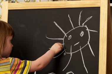 Drawing on a blackboard clipart