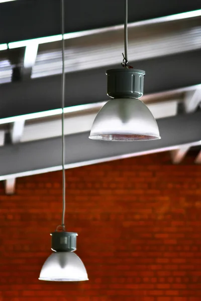 stock image Lamps, roof and red brick wall