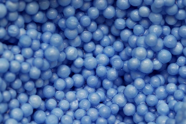 Μικρό μπλε μπάλες πλαστικό φόντο — Φωτογραφία Αρχείου