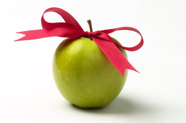 Green apple and red ribbon bow clipart