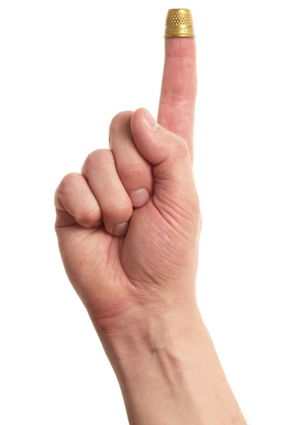 Finger mit einem Fingerhut — Stockfoto