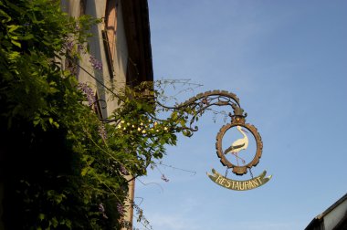 Riquewihr stork restaurant sign clipart