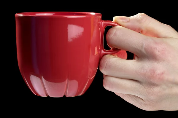 Little red tea cup in woman hand — Stock Photo, Image