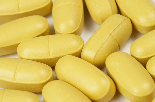 Pílulas de vitaminas fundo — Fotografia de Stock