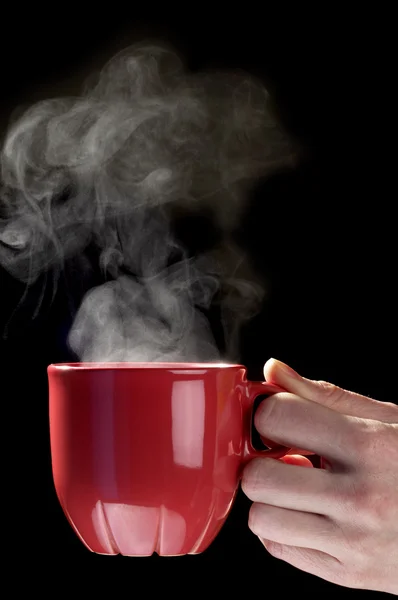 Petite tasse de thé rouge à la main de la femme — Photo