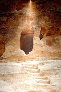 Mysterious light over a cave clipart