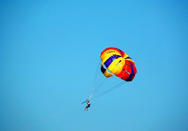 Man flies to parachute clipart