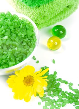 Bath salt, oil balls and green towels clipart