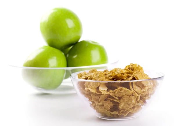 Cornflakes and green apples — Stock Photo, Image