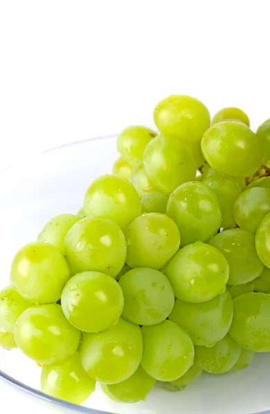 Зелений виноград у скляній мисці — стокове фото
