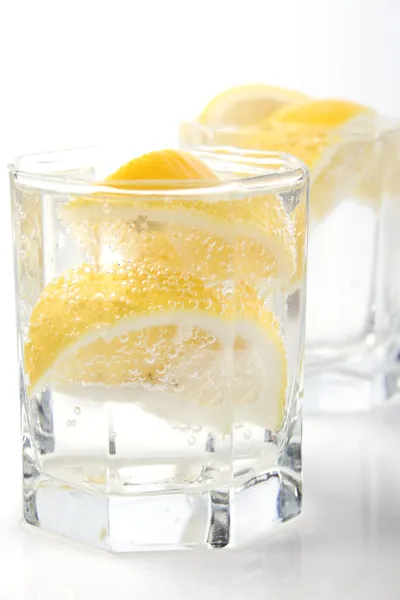 Glasses with soda water and lemon — Stock Photo, Image