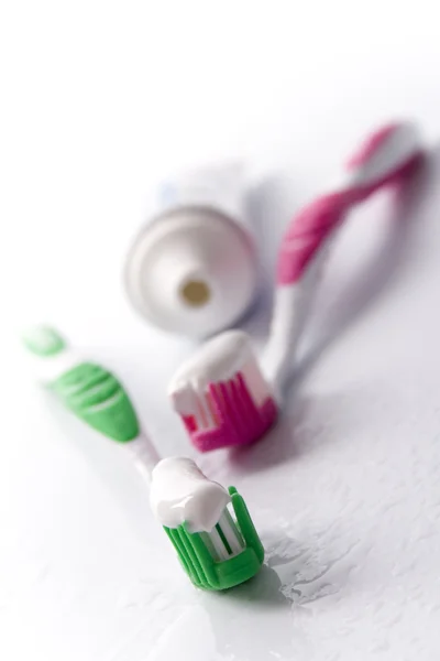 Toothpaste and toothbrushes — Stock Photo, Image