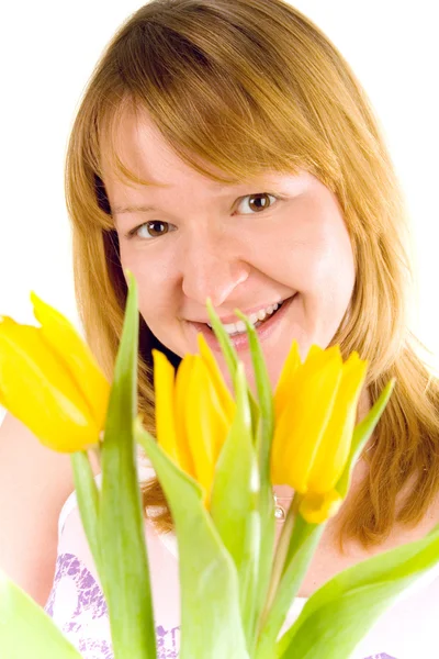 Woman with yellow tulips — Stock Photo, Image