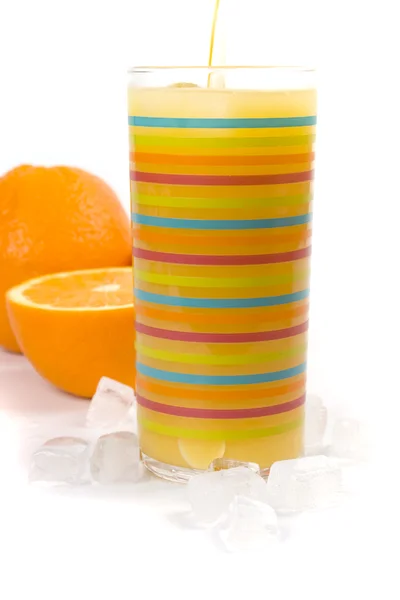 Апельсины, лёд и сок — стоковое фото