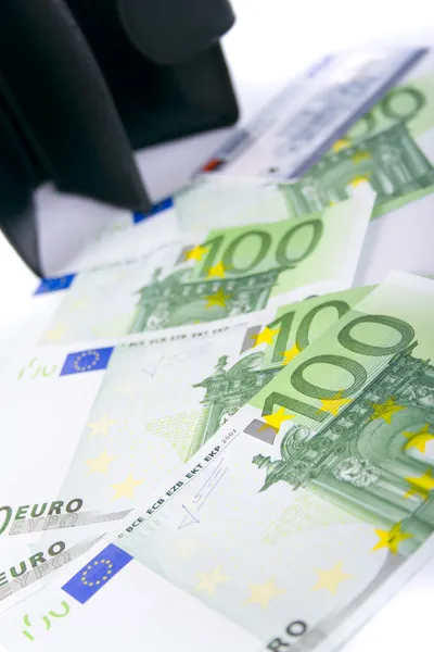 Euron och en skinnpung — Stockfoto