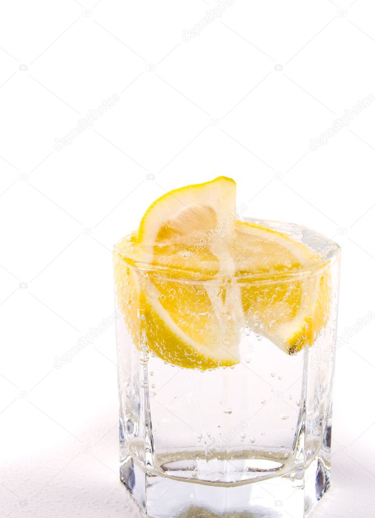 Glass with soda water and lemon