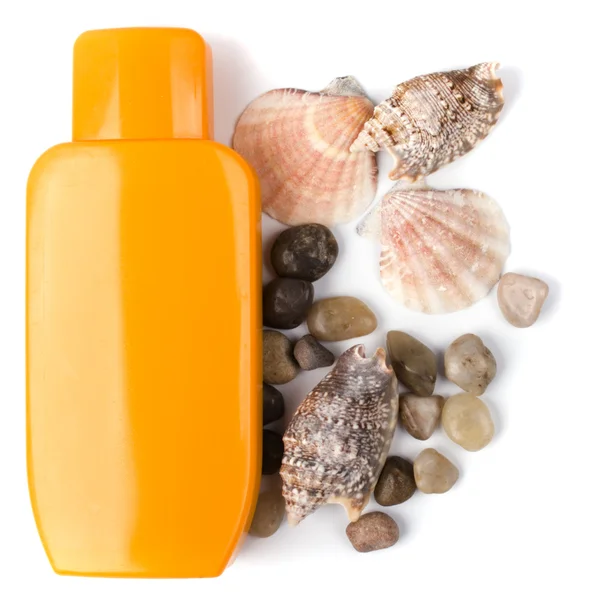 Lotion and some pebble and shells — Stock Photo, Image