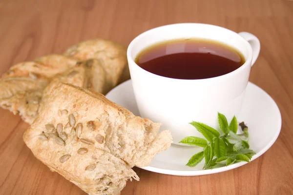Tea with herbs and bread — Stock Photo, Image
