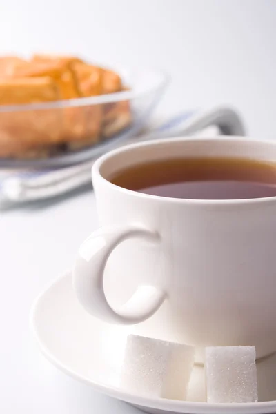 Cup of tea, sugar and cookies — Stock Photo, Image