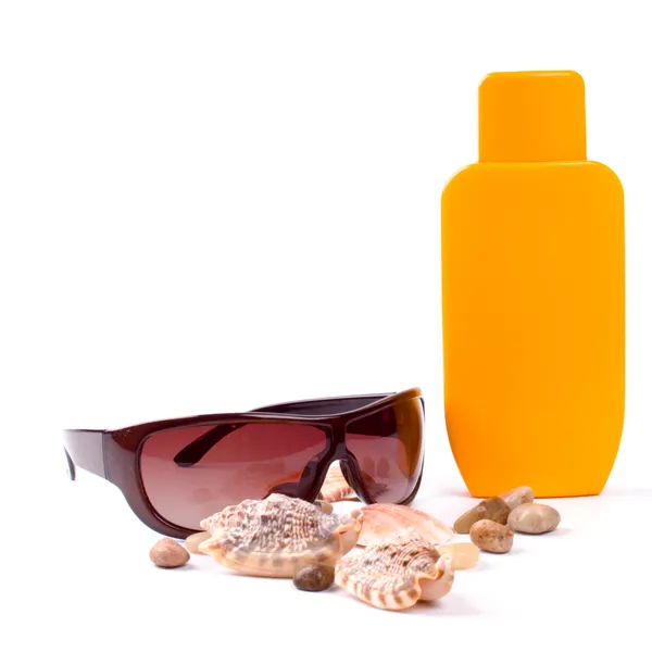 Sunglasses and lotion — Stock Photo, Image